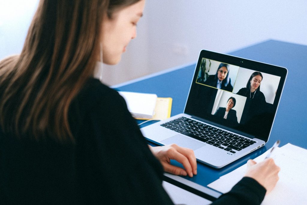 woman on a remote conference video meeting with team