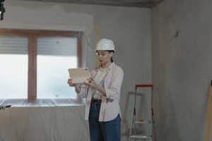 Woman on construction site wearing helmet