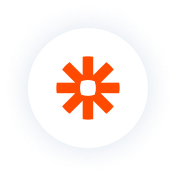 A bright orange asterisk-like logo is centered on a white circle against a black background, symbolizing a digital service or platform.